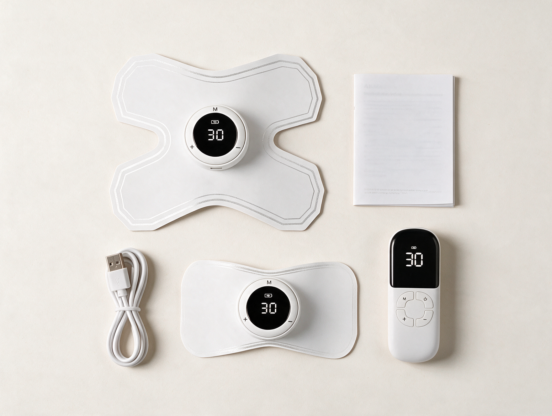ALIV full kit — two electrode pads, remote control, USB cable, and user manual
