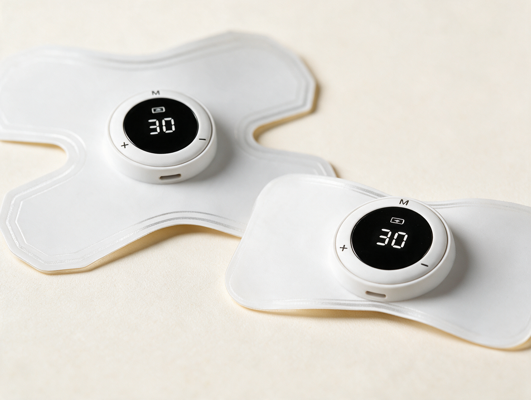 Close-up of ALIV electrode pads — four-headed and two-headed with LCD displays